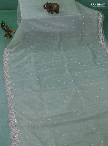 Crush tissue saree pastel green with sequin & cut beaded work