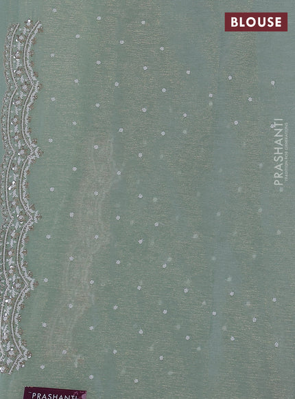 Crush tissue saree pastel green with sequin & cut beaded work