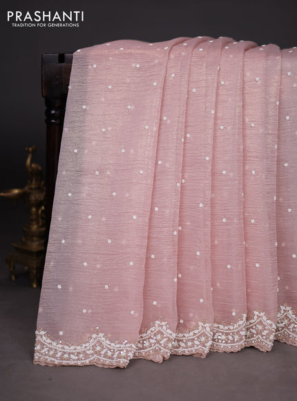 Crush tissue saree pastel peach with sequin & cut beaded work