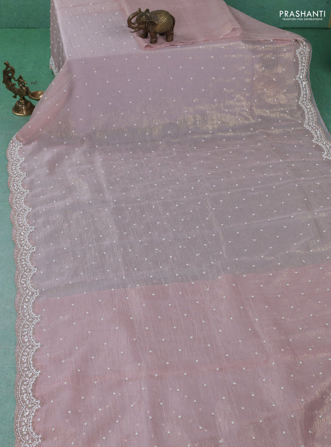 Crush tissue saree pastel peach with sequin & cut beaded work
