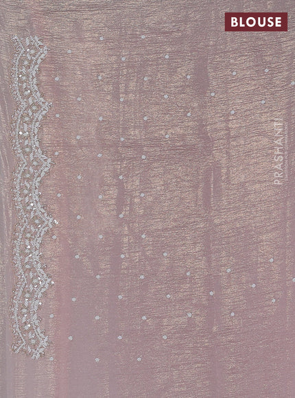 Crush tissue saree pastel peach with sequin & cut beaded work
