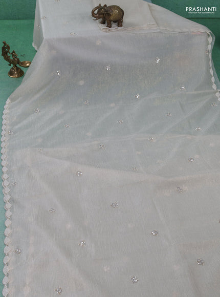 Crush tissue saree beige with sequin work buttas and beaded work border