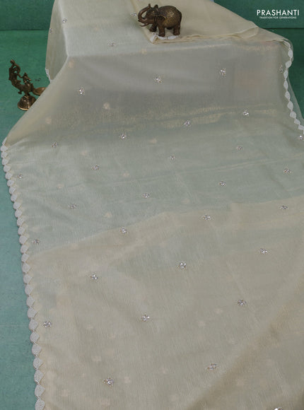Crush tissue saree cream with sequin work buttas and beaded work border