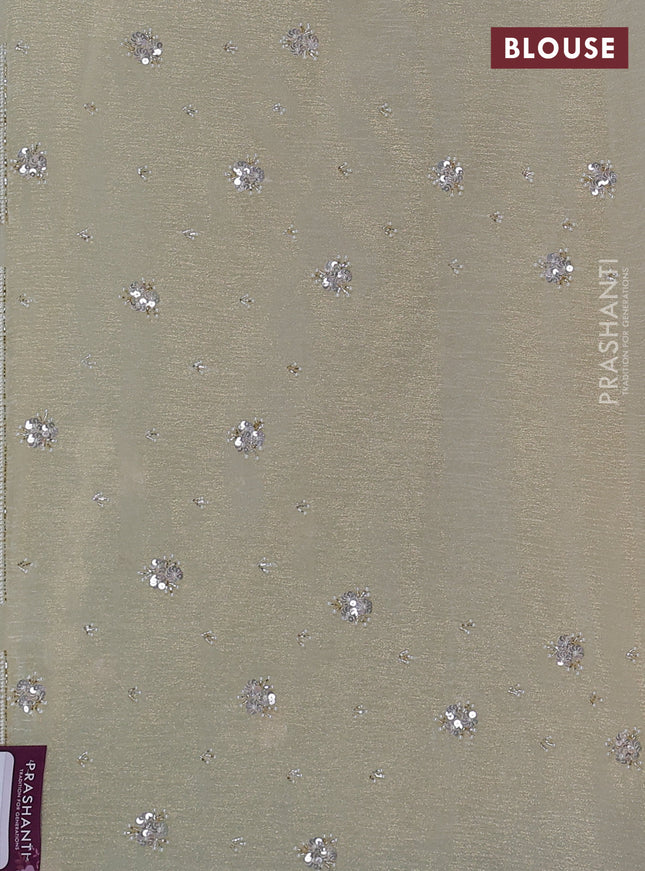 Crush tissue saree cream with sequin work buttas and beaded work border