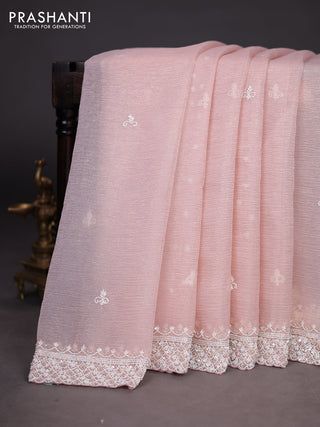Crush tissue saree pastel peach with beaded work and sequin & cut beaded work border