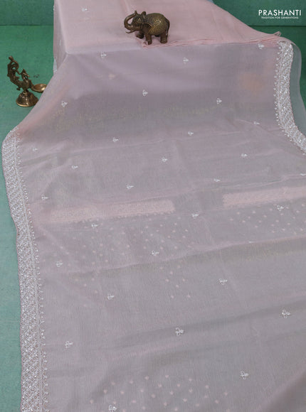 Crush tissue saree pastel peach with beaded work and sequin & cut beaded work border