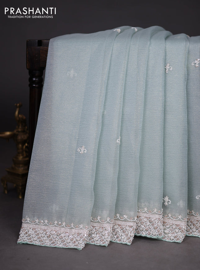 Crush tissue saree teal shade with beaded work and sequin & cut beaded work border