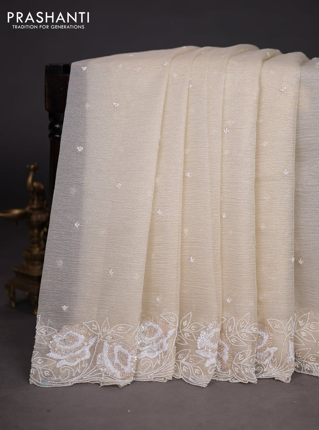 Crush tissue saree cream with beaded work and sequin & cut beaded work border