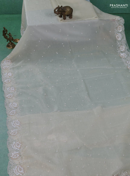 Crush tissue saree cream with beaded work and sequin & cut beaded work border
