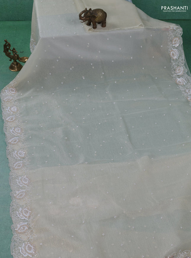 Crush tissue saree cream with beaded work and sequin & cut beaded work border