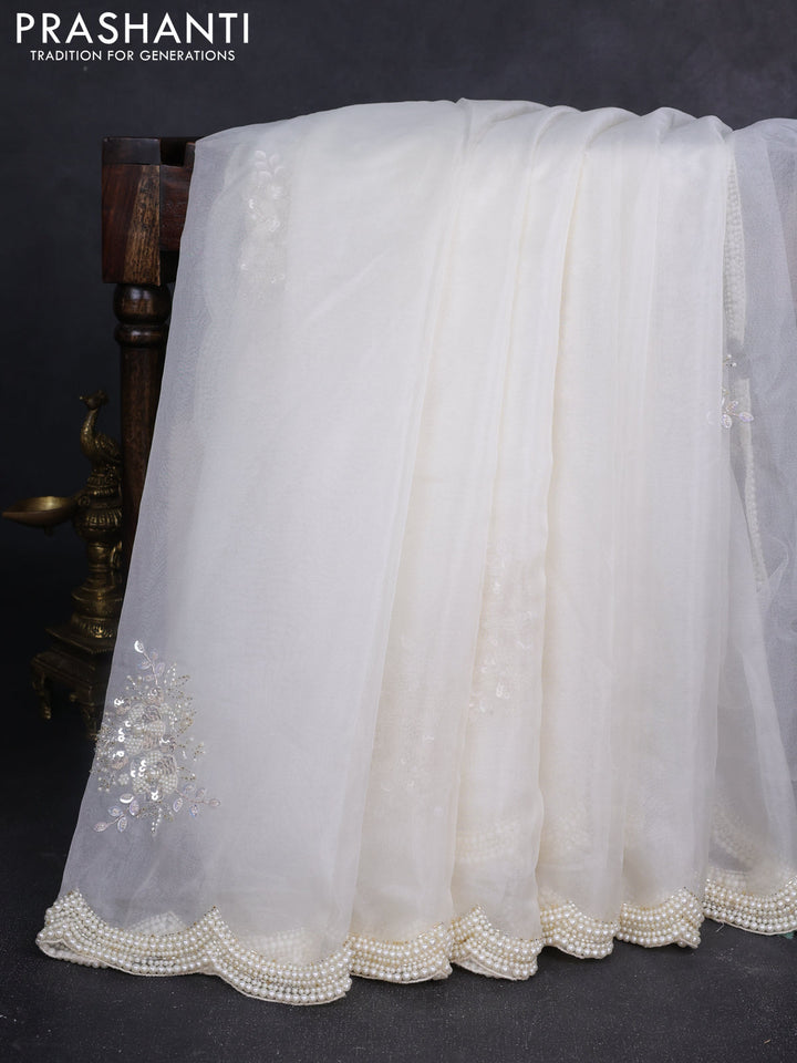 Organza silk saree off white with allover floral embroidery sequin work and beaded work border