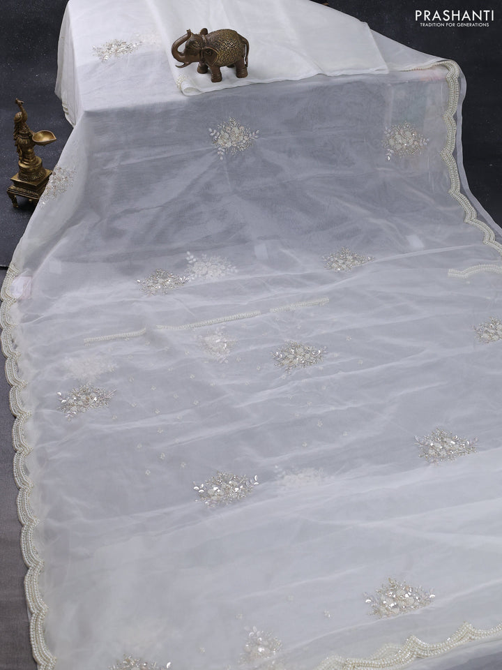 Organza silk saree off white with allover floral embroidery sequin work and beaded work border