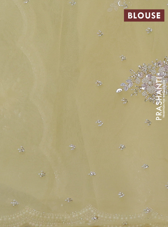 Organza silk saree yellow with allover floral embroidery sequin work and beaded work border