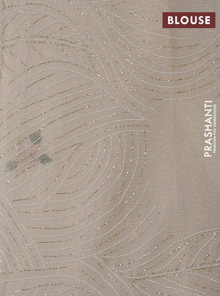 Crush tissue saree cream with allover floral embroidery sequin work