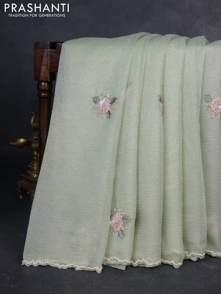 Crush tissue saree pastel green with allover floral embroidery sequin work