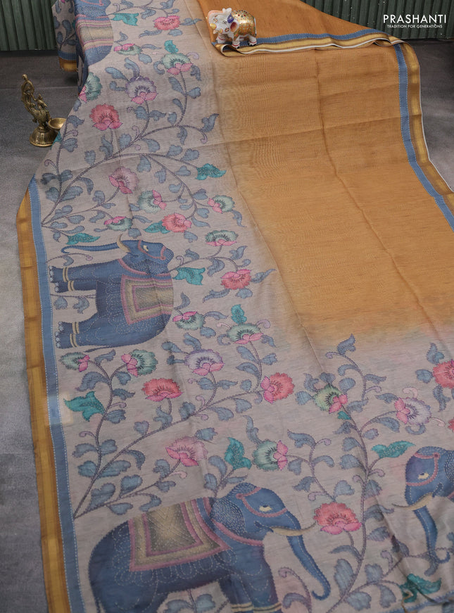 Art linen saree mustard shade and pastel grey with allover kalamkari prints and zari woven border