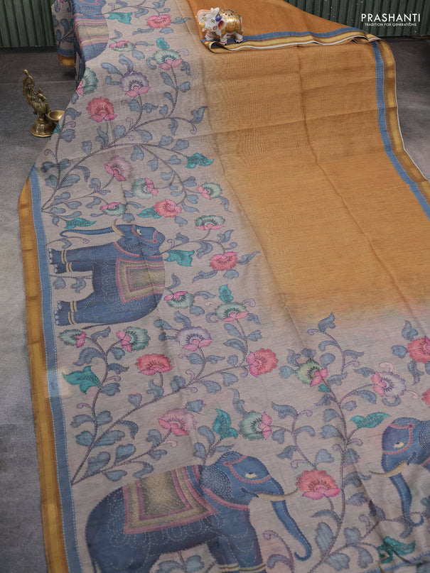 Art linen saree mustard shade and pastel grey with allover kalamkari prints and zari woven border