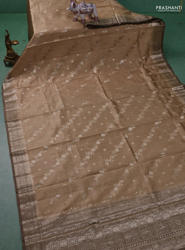 Chiniya silk saree sandal and pastel brown with allover zari weaves and zari woven border