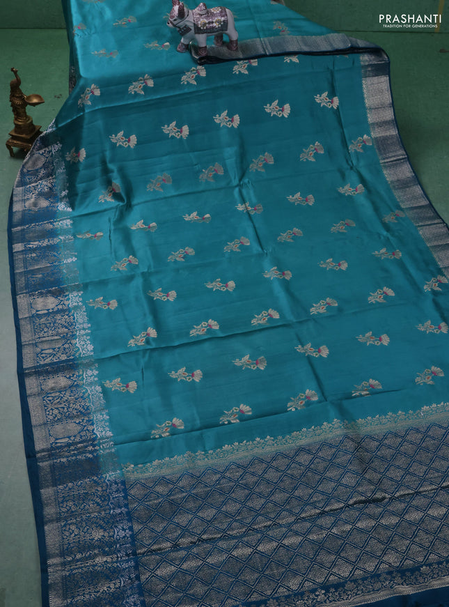 Chiniya silk saree teal blue and peacock blue with floral zari woven buttas and zari woven border