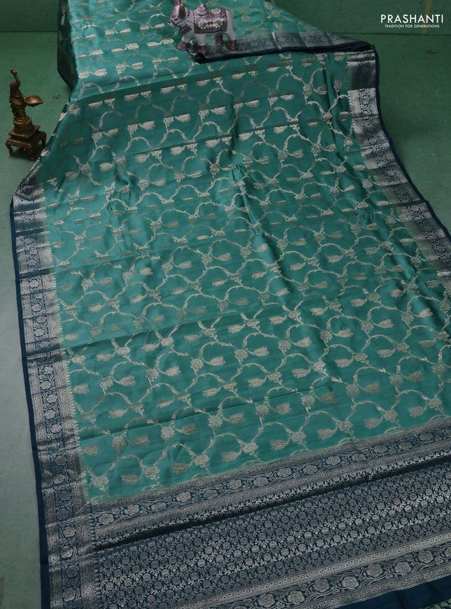 Chiniya silk saree teal shade and peacock blue with allover floral zari weaves and zari woven border