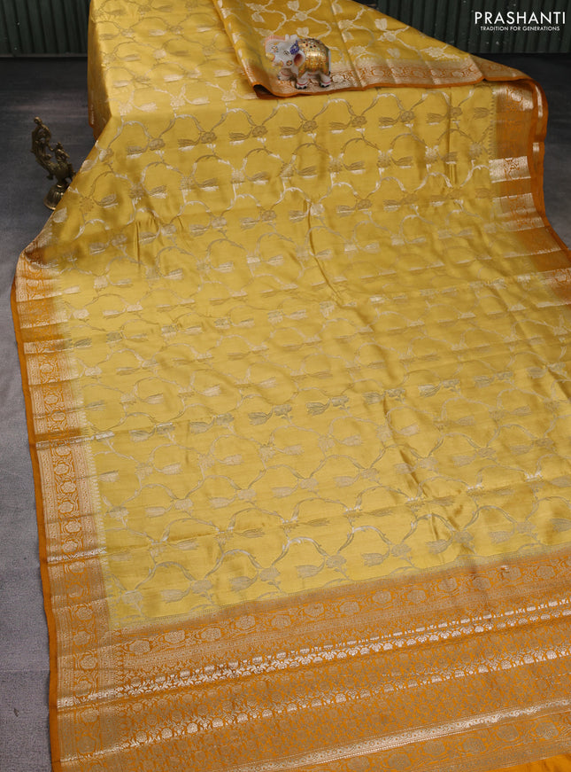 Chiniya silk saree mustard shade and dark mustard with allover floral zari weaves and zari woven border