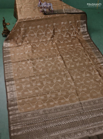 Chiniya silk saree sandal and brown shade with allover floral zari weaves and zari woven border