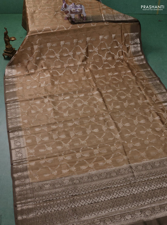 Chiniya silk saree sandal and brown shade with allover floral zari weaves and zari woven border