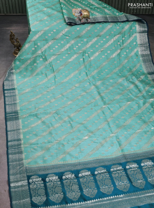 Chiniya silk saree teal blue and peacock blue with allover zari weaves and zari woven border
