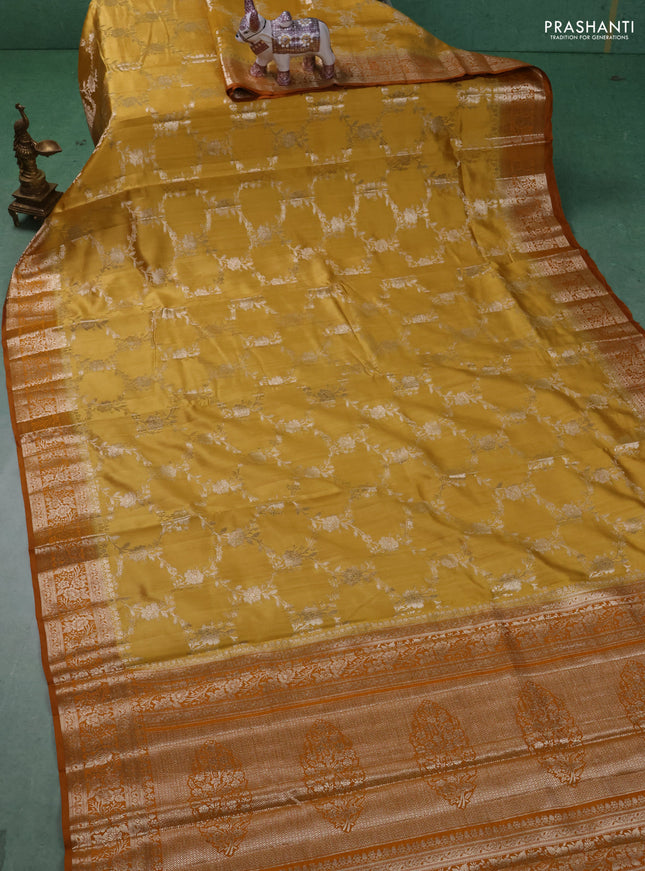 Chiniya silk saree mustard yellow and dark mustard with allover floral zari weaves and zari woven border