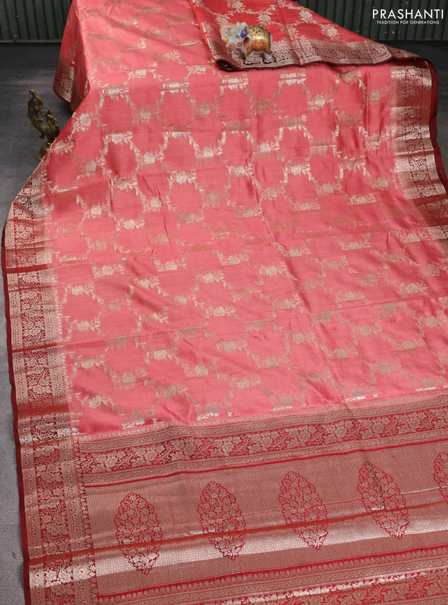 Chiniya silk saree peach shade and maroon with allover floral zari weaves and zari woven border