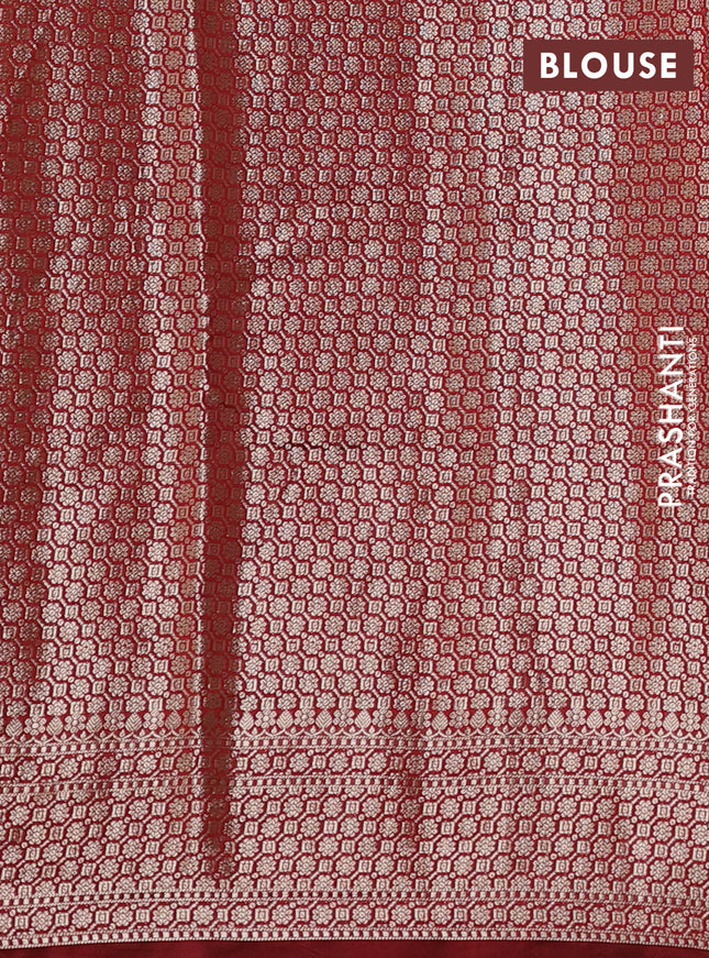 Chiniya silk saree peach shade and maroon with allover floral zari weaves and zari woven border