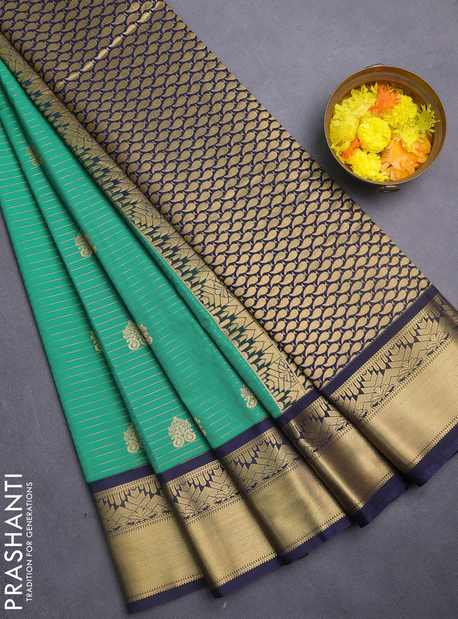Semi kanchipuram silk saree green and blue with allover zari weaves & buttas and rich zari woven korvai border