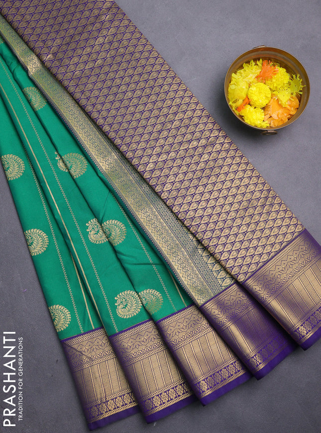 Semi kanchipuram silk saree green and navy blue with allover zari weaves & buttas and zari woven korvai border