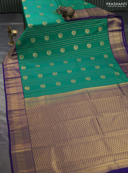 Semi kanchipuram silk saree green and navy blue with allover zari weaves & buttas and zari woven korvai border