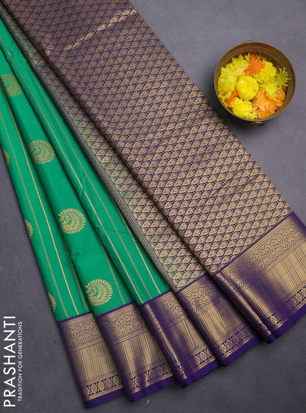 Semi kanchipuram silk saree green and navy blue with allover zari weaves & buttas and zari woven korvai border