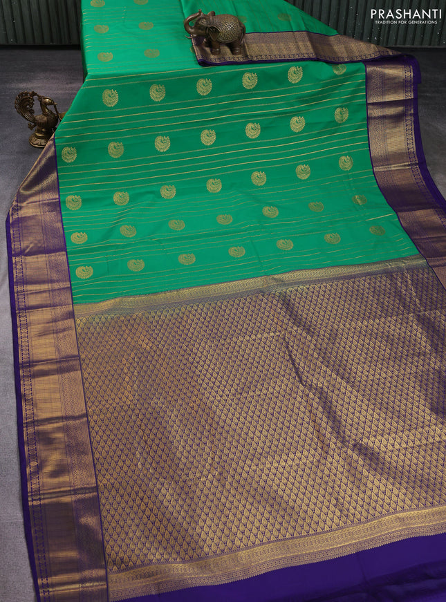 Semi kanchipuram silk saree green and navy blue with allover zari weaves & buttas and zari woven korvai border