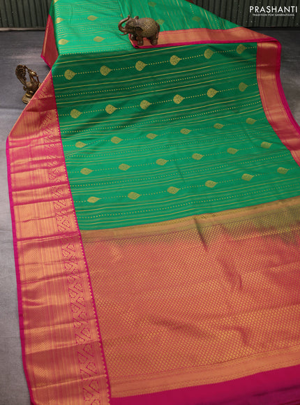 Semi kanchipuram silk saree green and pink with allover zari weaves & buttas and long zari woven border