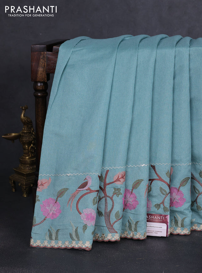 Tissue organza saree teal blue with plain body and embroidery border