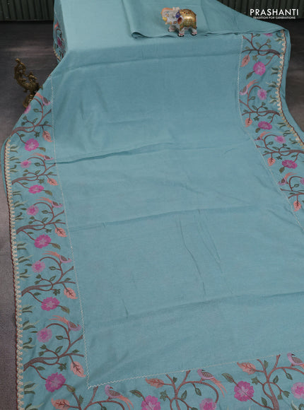 Tissue organza saree teal blue with plain body and embroidery border