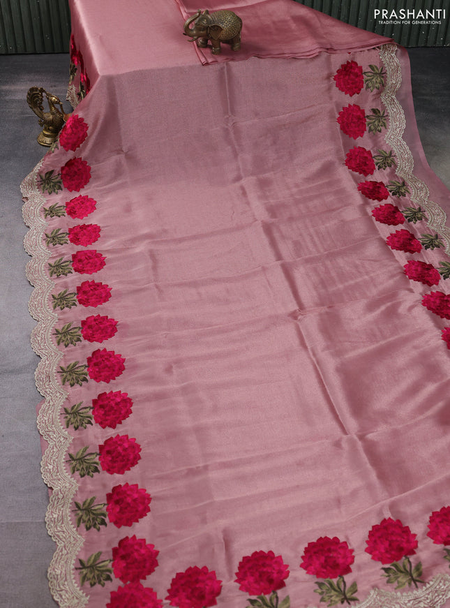 Tissue organza saree pastel peach with plain body and floral embroidery border