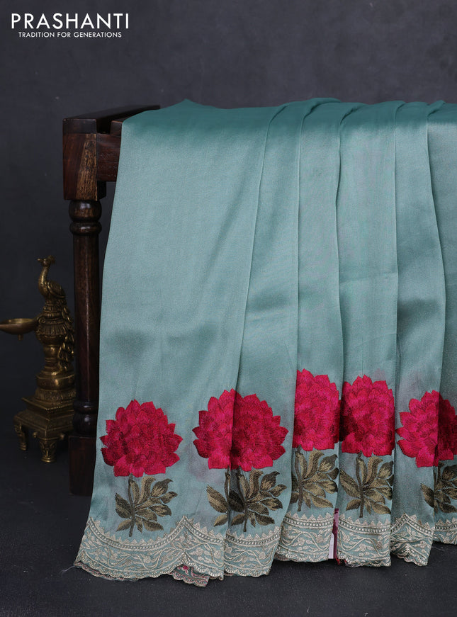 Tissue organza saree pastel green with plain body and floral embroidery border