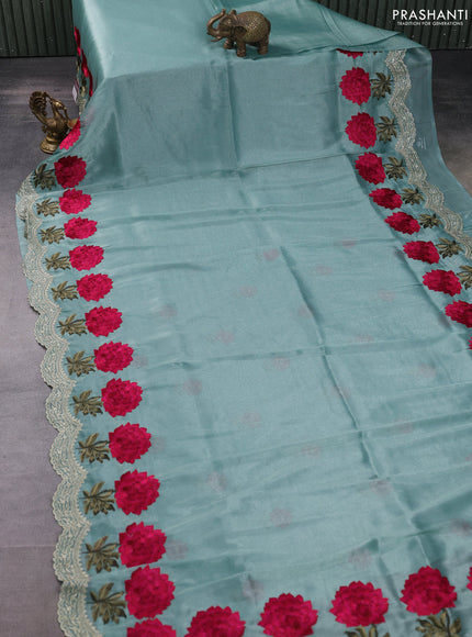 Tissue organza saree pastel green with plain body and floral embroidery border
