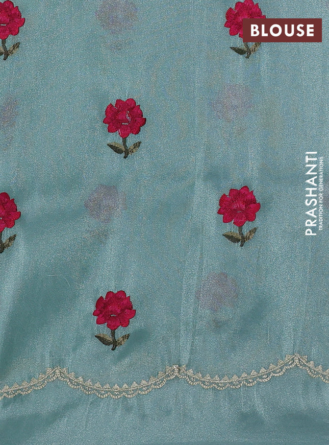Tissue organza saree pastel green with plain body and floral embroidery border