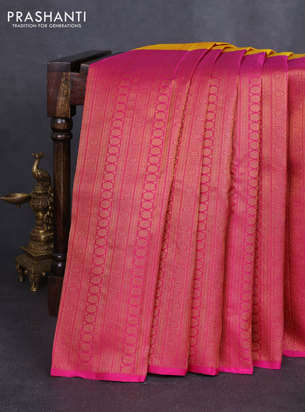 Pure kanchipuram silk saree mustard yellow and pink with half & half style and long zari woven border