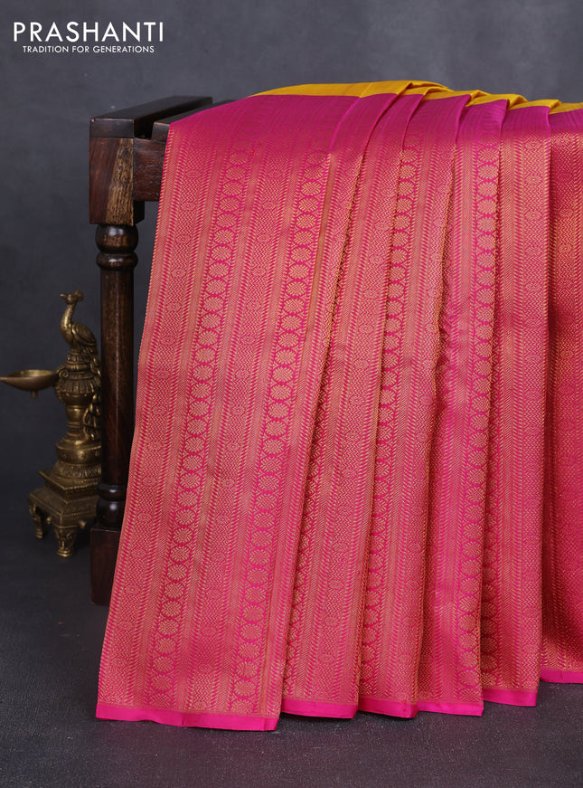 Pure kanchipuram silk saree mustard yellow and pink with half & half style and long zari woven border