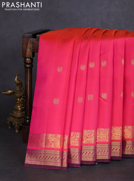 Pure kanchipuram silk saree dual shade of pinkish orange and purple with zari woven buttas and rich zari woven border