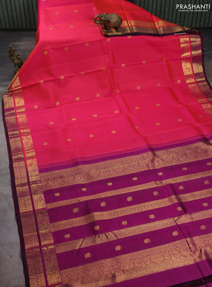 Pure kanchipuram silk saree dual shade of pinkish orange and purple with zari woven buttas and rich zari woven border
