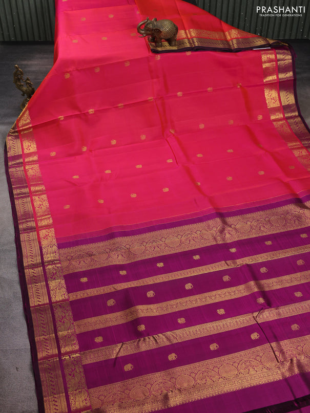 Pure kanchipuram silk saree dual shade of pinkish orange and purple with zari woven buttas and rich zari woven border