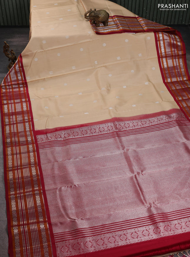 Pure kanchipuram silk saree beige and maroon with silver zari woven buttas and thread & zari woven border