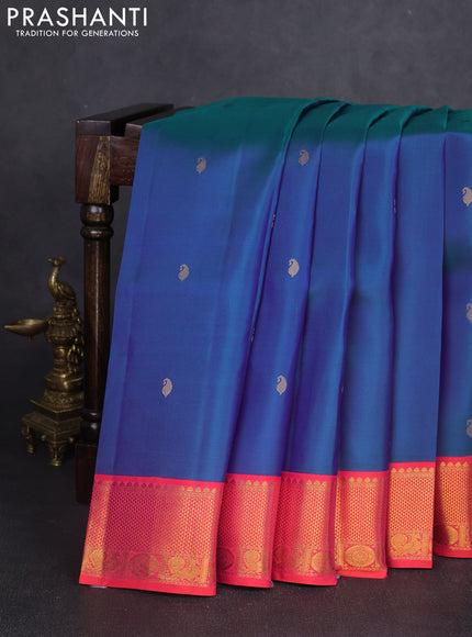 Pure kanchipuram silk saree dual shade of bluish green and dual shade of pinkish orange with paisley zari woven buttas and rich zari woven border